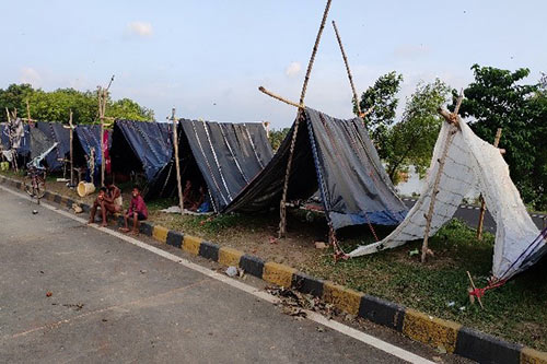 Makeshift tents line a street in flood-affected Bihar.