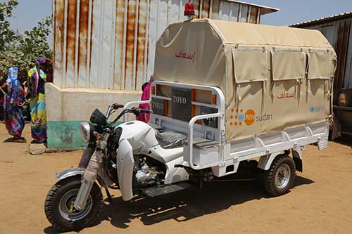 A motorcycle ambulance, called a tuk-tuk, is being provided to the local community.