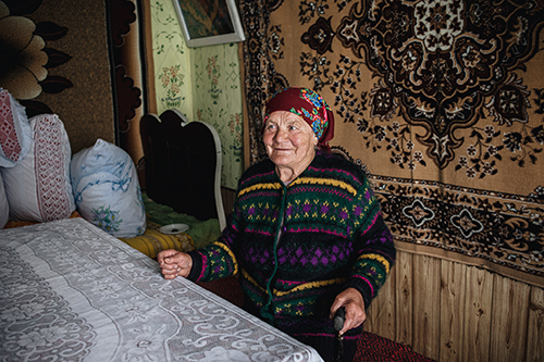 Maria Rosca sits in her home in Moldova.