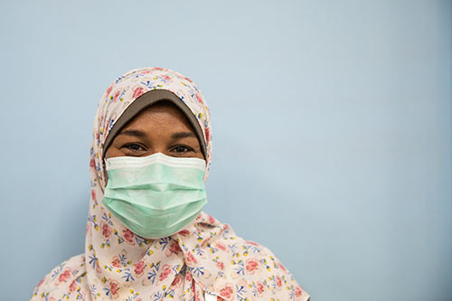 Nashwa Mohamed wears a face mask and hijab in the family planning unit.