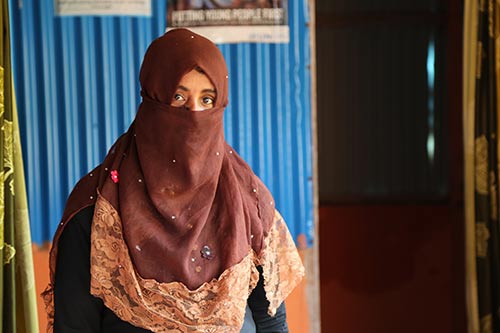 Rokeya stands in a women-led community centre.