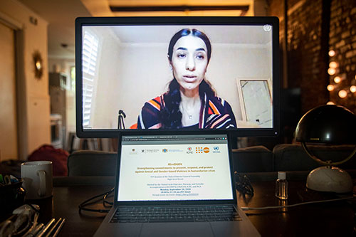 Nadia Murad, Nobel Peace laureate, is seen on a computer monitor addressing delegates in the virtual event on sexual and gender-based violence.
