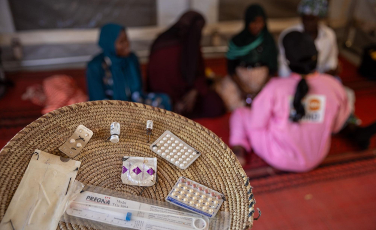 Sudanese refugee women learn about the different kinds of contraception methods available at a UNFPA-supported health centre in the Farchana refugee camp in Chad. © UNFPA Chad/Karel Prinsloo