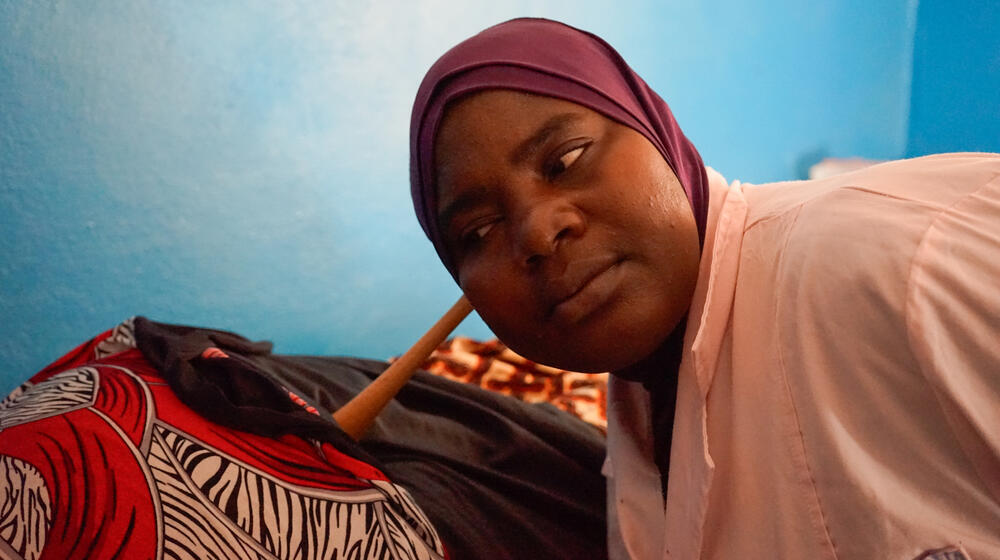 Midwife checks on patient.