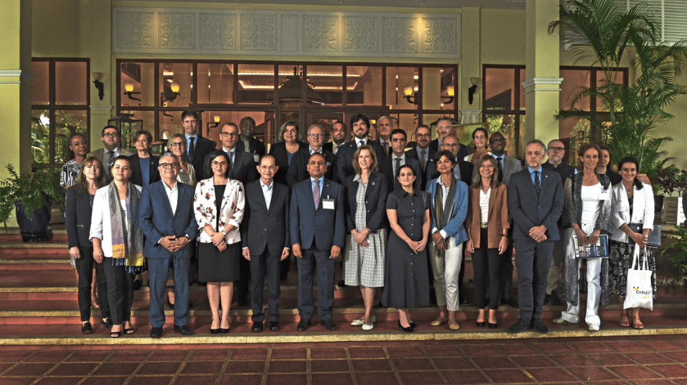 Group of colleagues pose for photo.