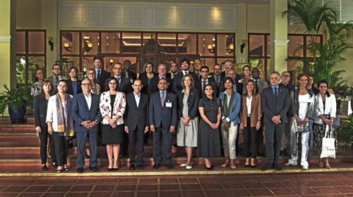 Group of colleagues pose for photo.