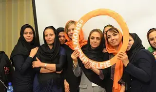 Youth volunteers in Iran show their selfies to promote role of…